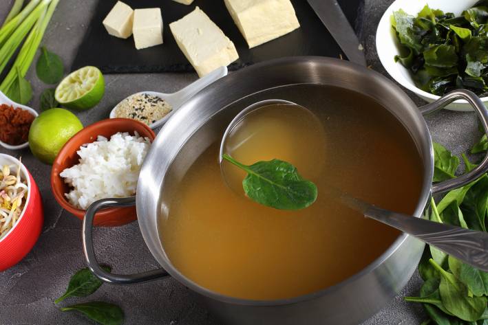 a pot of simmering asian broth