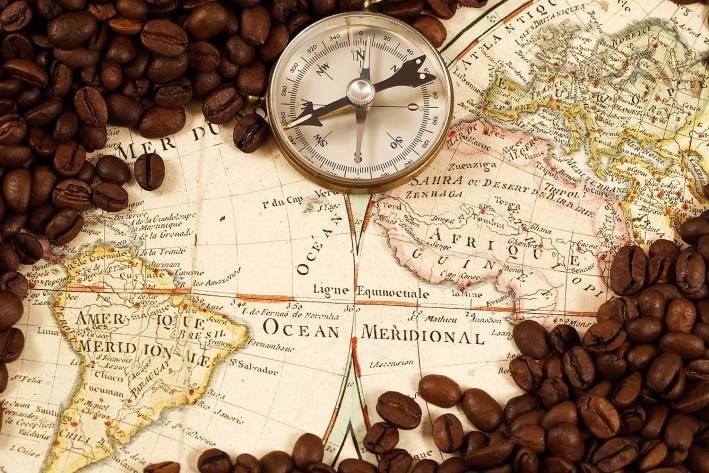 a historic map covered in coffee beans