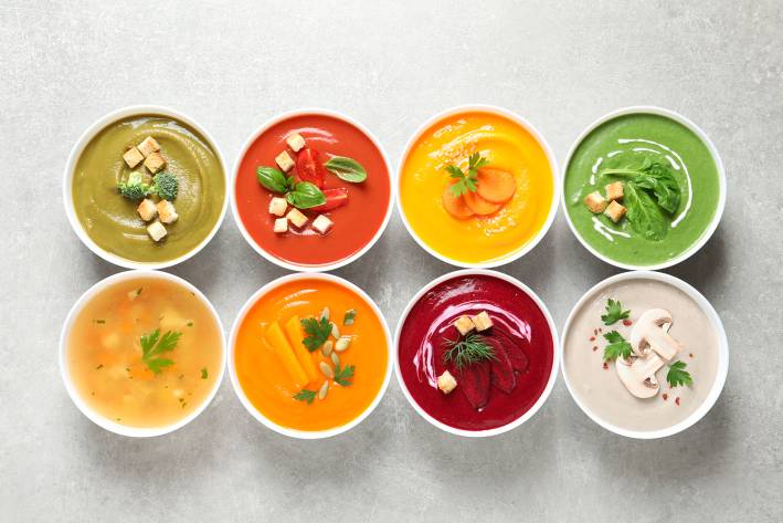 bowls of various creamy soups