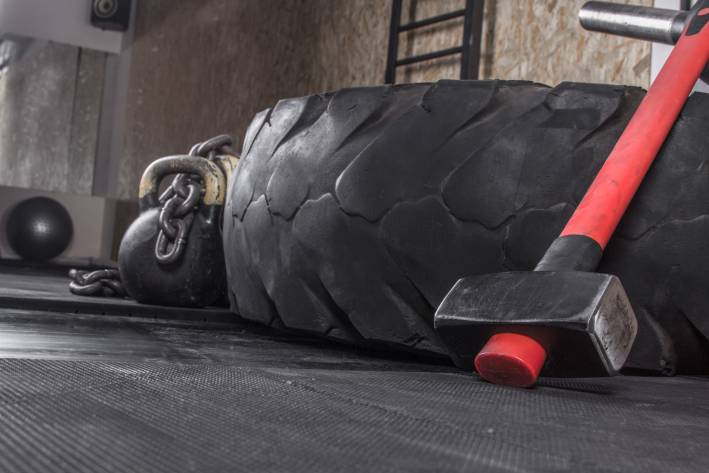 Different crossfit equipment used for crossfit training in a gym.