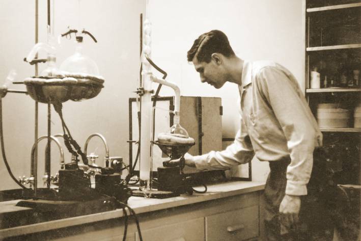 An old photo of Elwood Richard working in his lab