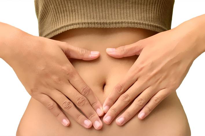 a woman massaging her abdomen