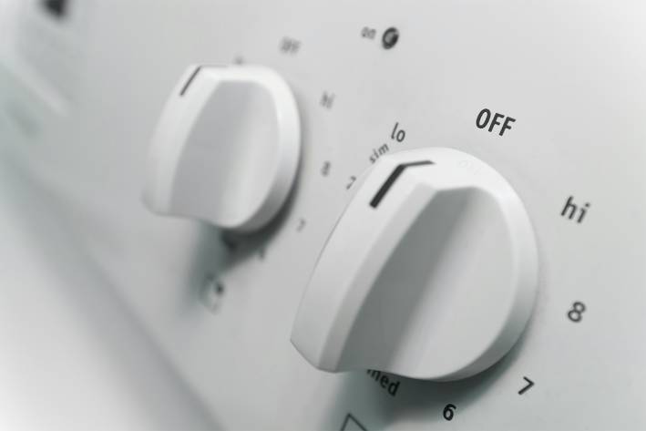 temperature knobs on a home stove-top range