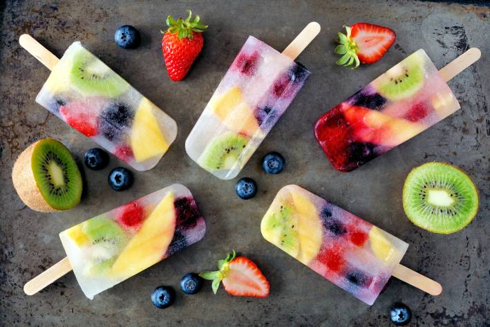 a variety of frozen pops with real fruit