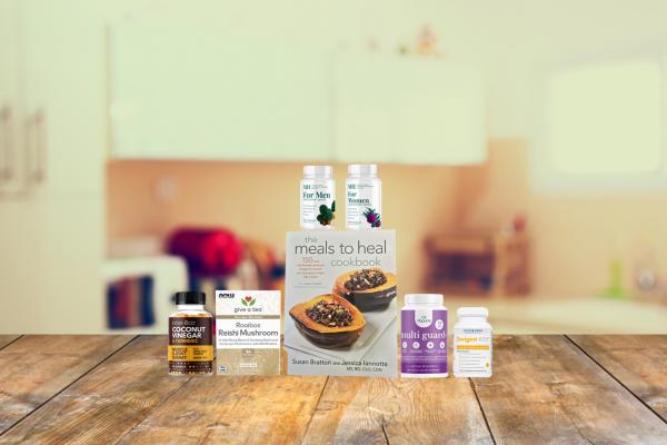 a selection of supplements and a book of anti-cancer recipes