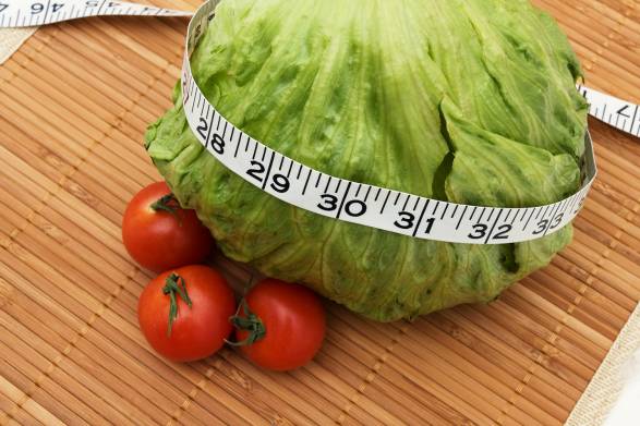 healthy foods and a tape measure for weight loss