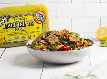 salad with croutons in white bowl