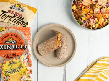 veggie wrap on plate tortilla packages on the table