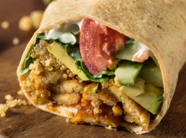 Tempeh veggie wrap, shot from the front so ingredients are displayed.