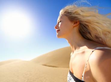 A woman in the desert heat, with beautiful youthful skin