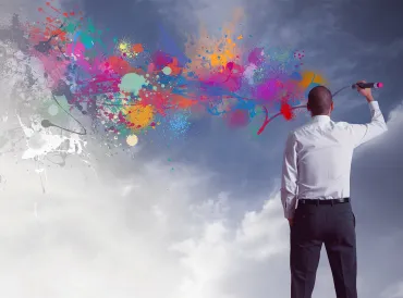 A man coloring over gray skies