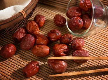 dried jujube seeds on a bamboo mat