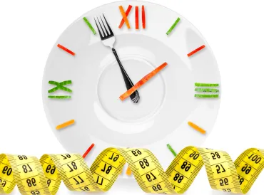 A clock made out of food and a measuring tape