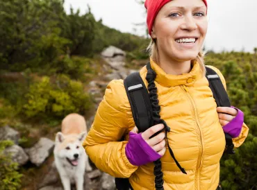woman hiking with dog