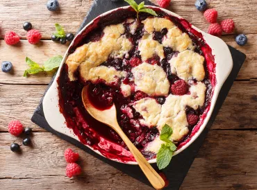 a dish of freshly baked berry cobbler