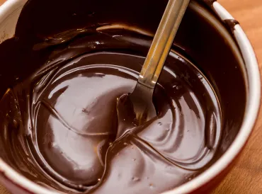A bowl of melted chocolate.