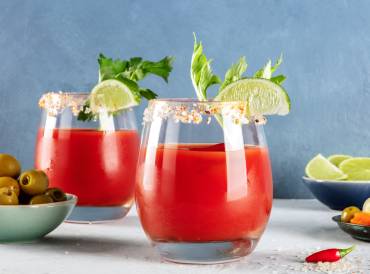 two glasses of non-alcholic bloody mary with garnish