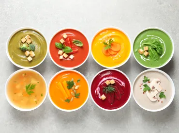 bowls of various creamy soups