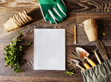 gardening tools and a notebook