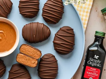 chocolate peanut butter on blue plate with vanilla extract bottle