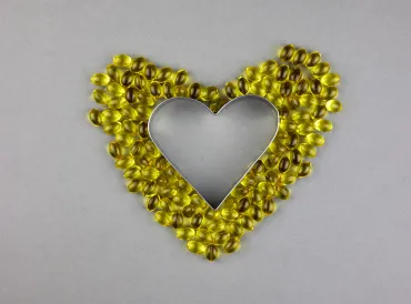 vitamin d3 supplements arranged into a heart shape
