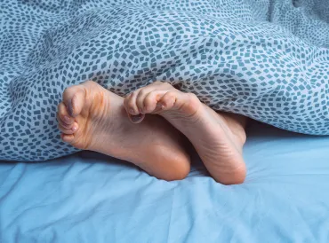 cold feet spasming out from under the blanket