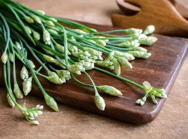 garlic chives on a cutting board
