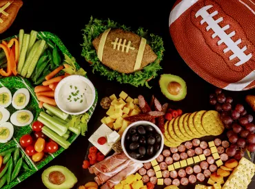 a football-themed spread of snacks and finger foods