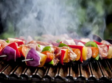 shish kebabs with vegetables, fruit, and meat, smoking and steaming