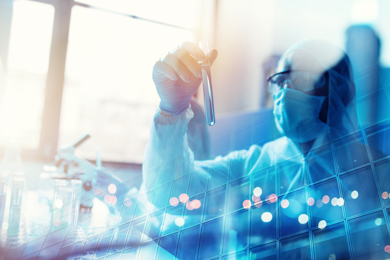 Doctor studying a vial during covid-19 coronavirus research.